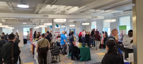 Crowds of people at Veterans & Community Job Fair held 9-27-23 at CareerForce Minneapolis North