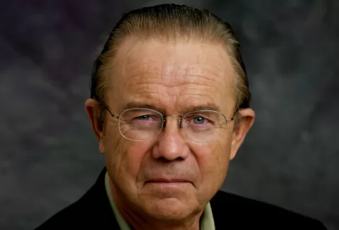 man with glasses looking at camera