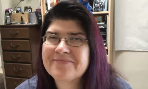 smiling woman wearing glasses