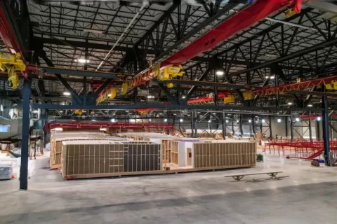 stacks of materials in very large warehouse space