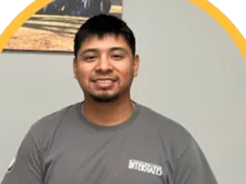 photo of smiling person wearing a gray t-shirt with the Interstates logo