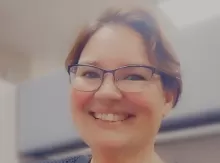 smiling woman wearing glasses