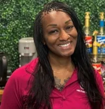 Smiling person wearing red Land O' Lakes shirt